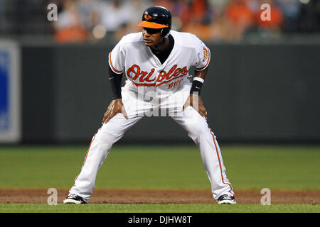 Baltimore Orioles center fielder Adam Jones (10), and Cesar Izturis (3)  celebrate with relief pitcher Mike Gonzalez (51) after the Orioles defeated  the Tampa Bay Rays 5-0 during a baseball game Friday