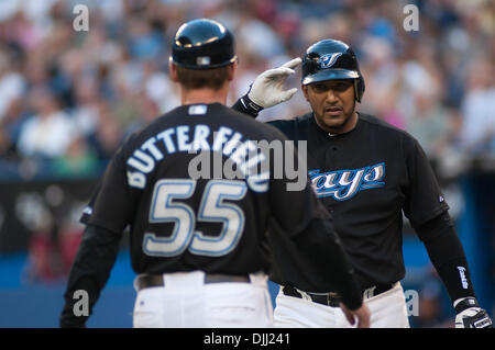 Toronto Blue Jays catcher Jose Molina (8) is congratulated by