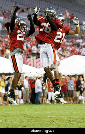 Seattle Seahawks' wide receiver T.J. Houshmandzadeh (R) breaks the tackle  of Tampa Bay Buccaneers ' safety Sabby.