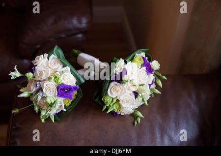 A set of bridal bouquets arranged on a leather sofa Stock Photo