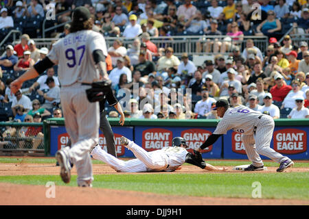 Aug. 08, 2010 - Pittsburgh, PENNSYLVANNIA, United States of America - 08 August, 2010: Colorado Rockies' relief pitcher JOE BEIMEL (97) gets the throw to Colorado Rockies' 1B MELVIN MORA (6) to pick off Pittsburgh Pirates' 2B NEIL WALKER (18) as he tries to get back to first in the seventh inning as the Pirates take on the Rockies at PNC Park in Pittsburgh, PA...The Pirates fall to Stock Photo