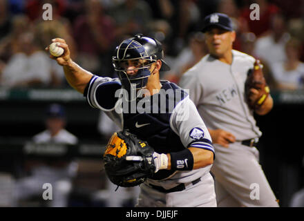 New York Yankees catcher Jorge Posada just misses Alex Gonzalez of