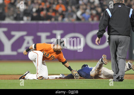 Aug. 13, 2010 - San Francisco, California, United States of America - 13 August, 2010:  San Francisco Giants shortstop Juan Uribe (5) tags out San Diego Padres left fielder Chris Denorfia (13) during Friday's game at AT&T Park.  Padres defeat the Giants 3-2..Mandatory Credit: Scott Beley / Southcreek Global (Credit Image: © Southcreek Global/ZUMApress.com) Stock Photo