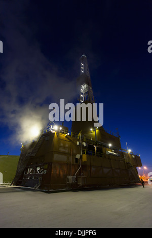 Doyon Oil Rig 14 On The Road Moving To Another Drill Site In The Prudhoe Bay Oil Field, North Slope, Arctic Alaska, Winter Stock Photo