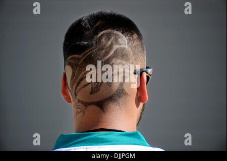 Aug. 17, 2010 - Davie, FL - Florida, USA - United States - fl-dolphins-camp-081710a.....Davie, Fl......Dolphin fan Nicholas Ariza of Miami Gardens sports a Dolphin's emblem as part of his fade haircut. Ariza plans on dying his hair with Dolphin colors for the Sept 26th game against the Jets.    Susan Stocker, Sun Sentinel (Credit Image: © Sun-Sentinel/ZUMApress.com) Stock Photo