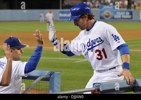 Aug. 21, 2010 - Los Angeles, California, United States of America - Los Angeles Dodgers first baseman Jay Gibbons (31) is congratulated by manager Joe Torre (6) after hitting a home run in the third inning. The Cincinnati Reds were losing to the Los Angeles Dodgers with five innings complete at Dodger Stadium in Los Angeles, California.  Mandatory Credit: Andrew Fielding / Southcre Stock Photo