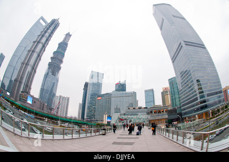 On left: Shanghai World Financial Center, Jin Mao Tower and Shanghai Central Tower in Pudong, Shanghai. Right: IFC North Tower Stock Photo
