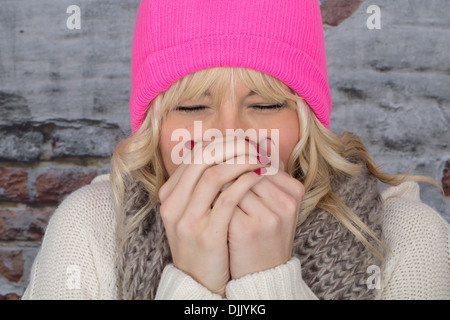 Model Released. Attractive Young Woman Sneezing Stock Photo
