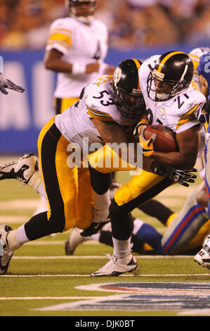 21 Aug, 2010: Pittsburgh Steelers running back Mewelde Moore (21) is taken down by shoved a teammate, guard Maurkice Pouncey (53) during first half NFL preseason action between the New York Giants and Pittsburgh Steelers at New Meadowlands Stadium in East Rutherford, New Jersey. (Credit Image: © Will Schneekloth/Southcreek Global/ZUMApress.com) Stock Photo