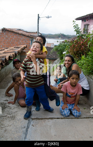 Children on the street in Guatape, Colombia Stock Photo