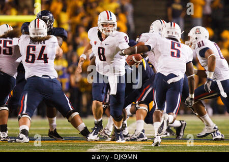 Nebraska defensive tackle Ndamukong Suh #93 and Arizona center Colin Baxter  #64 mix it up during game action in the Pacific Life Holiday Bowl at  Qualcomm Stadium San Diego, CA. Nebraska defeated