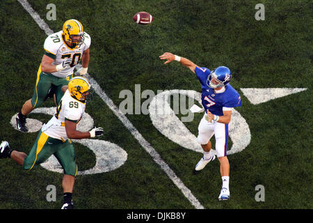 Sep. 04, 2010 - Lawrence, Kansas, United States of America - Kansas quarterback Kale Pick (7) throws over North Dakota State defensive tackle Matthew Gratzek (70) and nose tackle Leevon Perry (69) during game action at Memorial Stadium in Lawrence, Kansas.  The North Dakota State Bisons defeated the Kansas Jayhawks 6-3. (Credit Image: © Jacob Paulsen/Southcreek Global/ZUMApress.com Stock Photo