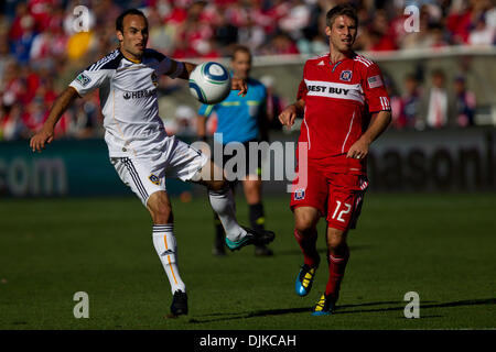 Sep. 04, 2010 - Bridgeview, Illinois, United States of America - Los Angeles Galaxy forward Landon Donovan (10) takes a shot on goal  while Chicago Fire midfielder Logan Pause (12)  looks on during the MLS game between the Chicago Fire and the Los Angeles Galaxy at Toyota Park in Bridgeview, IL. The Fire tied the Galaxy 1-1. (Credit Image: © Geoffrey Siehr/Southcreek Global/ZUMApre Stock Photo