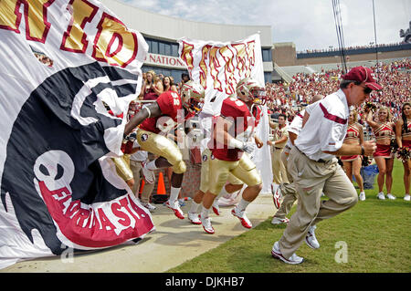 Sept. 7, 2010 - Jacksonville, Florida, United States of America - January 4, 2010: FSU Head Coach Jimbo Fisher leads his team out of the tunnel for the season opener against the Samford Bulldogs. Fisher replaced legendary Coach Bobby Bowden as FSU's head coach. FSU defeated Samford 59-6 at Doak Campbell Stadium in Tallahassee, Florida. (Credit Image: © Mike Olivella/Southcreek Glob Stock Photo