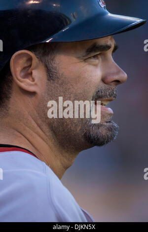 Boston Red Sox Mike Lowell makes contact with the ball but hits a