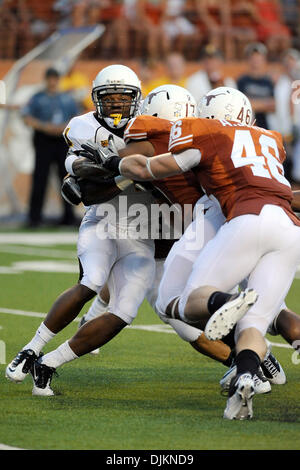 Sept. 11, 2010 - Austin, Texas, United States of America - Wyoming Cowboys wide receiver DeJay Lester (1) is tackled for a loss during the game between the University of Texas and the University of Wyoming. The Longhorns defeated the Cowboys 34-7 (Credit Image: © Jerome Miron/Southcreek Global/ZUMApress.com) Stock Photo