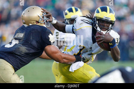 Sept. 11, 2010 - South Bend, in, usa - University of Michigan quarterback Denard Robinson stiff arms Notre Dame linebacker Manti Te'o and breaks free for a long gain Saturday September 11, 2010 at Notre Dame Stadium in South Bend, Indiana.  Michigan beat Notre Dame 28-24. (Credit Image: © Jim Z. Rider/ZUMApress.com) Stock Photo