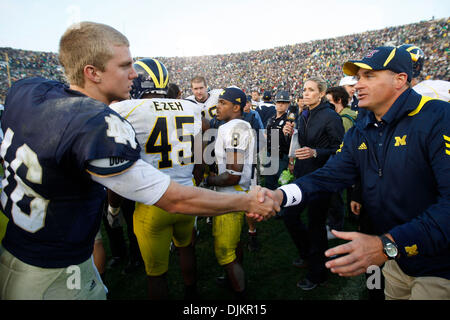 Sept. 11, 2010 - South Bend, Indiana, USA - University of Michigan coach Rich Rodriguez shakes hands with Notre Dame quarterback Nate Montana Saturday September 11, 2010 after Michigan beat Notre Dame 28-24 at Notre Dame Stadium in South Bend, Indiana. (Credit Image: © Jim Z. Rider/ZUMApress.com) Stock Photo