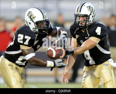 Sept. 11, 2010 - Orlando, Florida, United States of America - UCF Knights running back Jonathan Davis (27) takes the handoff from UCF Knights quarterback Rob Calabrese (4) during the game at Brighthouse Arena in Orlando, in which NC State defeated UCF 28-21. (Credit Image: © Brad Barr/Southcreek Global/ZUMApress.com) Stock Photo
