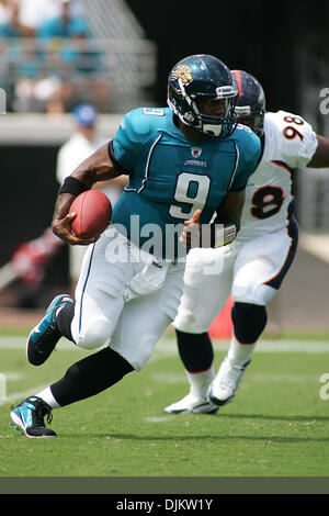 Jaguars #9 quarterback David Garrard tackled by Jets #30 Drew Coleman  before he can get the