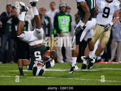 Sept. 18, 2010 - East Lansing, Mi, USA - Michigan State cornerback Johnny Adams intercepts a pass intended for Notre Dame wide receiver Theo Riddick and ends up on his head in the end zone in the first half Saturday September 18, 2010 at Spartan Stadium in East Lansing, Michigan.  Michigan State defeated Notre Dame 34-31. (Credit Image: © Jim Z. Rider/ZUMApress.com) Stock Photo