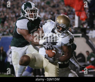 Sept. 18, 2010 - East Lansing, Mi, USA - University of Notre Dame wide receiver Michael Floyd scores in the second half Saturday September 18, 2010 at Spartan Stadium in East Lansing, Michigan.  Michigan State safety Marcus Hyde was on the coverage. Michigan State beat Notre Dame 34-31. (Credit Image: © Jim Z. Rider/ZUMApress.com) Stock Photo