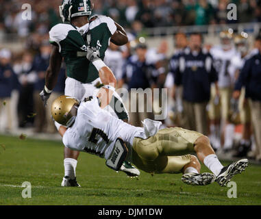 Sept. 18, 2010 - East Lansing, Mi, USA - Notre Dame safety Zeke Motta is called for a horse collar tackle as he hauls down Michigan State running back Edwin Baker Saturday September 18, 2010 at Spartan Stadium in East Lansing, Michigan.  Michigan State defeated Notre Dame 34-31. (Credit Image: © Jim Z. Rider/ZUMApress.com) Stock Photo