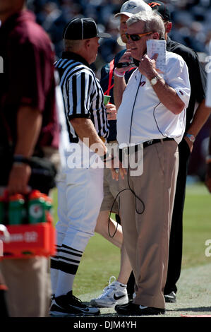 Virginia Tech head coach Frank Beamer leads his team onto the field to ...