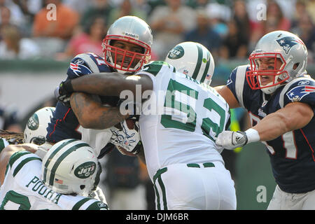 Sept. 19, 2010 - East Rutherford, New Jersey, United States of America - New England Patriots running back Fred Taylor (21) is met at the line by New York Jets linebacker David Harris (52) at New Meadowlands Stadium in East Rutherford New Jersey. The New England Patriots fall to the New York Jets 28-14 (Credit Image: © Brooks Van Arx/Southcreek Global/ZUMApress.com) Stock Photo