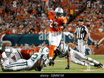 Sept. 26, 2010 - Boca Raton, florida, usa - 092610 (Bill Ingram /The Palm Beach Post): Miami Gardens: Miami Dolphins running back Ronnie Brown jumps over the Jets defenders   during first half action Sunday at Sun Life stadium in Miami Gardens. (Credit Image: © The Palm Beach Post/ZUMApress.com) Stock Photo