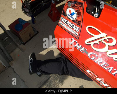 Mar 09, 2008 - Hampton, Georgia, USA - A crewmember makes adjustments underneath the Budweiser Dodge at Atlanta Motor Speedway. The teams were preparing for the running of the Kobalt Tools 500 at AMS. (Credit Image: © Timothy L. Hale/ZUMA Press) Stock Photo