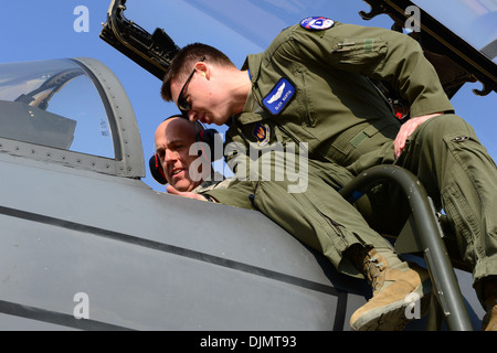 Capt. Jackson Martin, 492nd Fighter Squadron pilot shows the cockpit on an F-15E Strike Eagle to Brig. Gen. John Shapland, U.S. Stock Photo