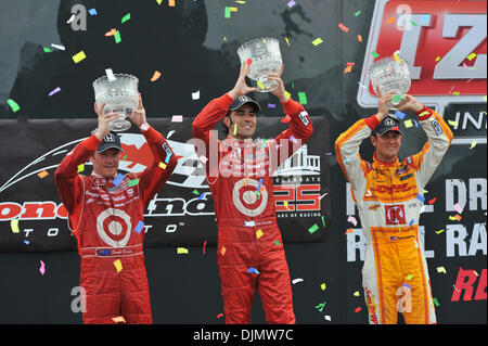 July 10, 2010 - Toronto, Ontario, Canada - Winners, Dario, Franchitti, Scott Dixon and Ryan Hunter-Reay hoist their trophy's at the Honda Indy Toronto (Credit Image: © Steve Dormer/Southcreek Global/ZUMAPRESS.com) Stock Photo