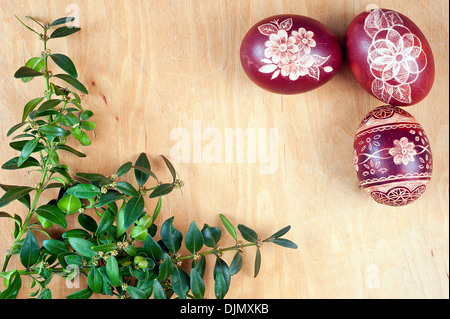 Red scripts at wooden background, boxwood in corner Stock Photo