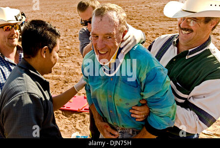 Oct 03, 2008 - Las Vegas, Nevada, USA - DONNIE MILLER, 67, smiles and assures paramedics and his fellow competitors that he's ok after being thrown by a bull and knocked unconscious at the National Senior Pro Rodeo Association circuit stop in Las Vegas.  Male and female rodeo performers age 40 plus compete for NSPRA prize money in sanctioned events throughout the year across 20 US  Stock Photo