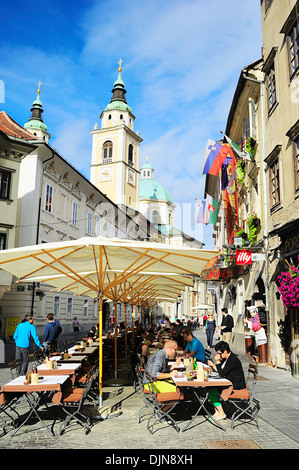 People at street cafe in old town of Ljubljana, Slovenia. Stock Photo