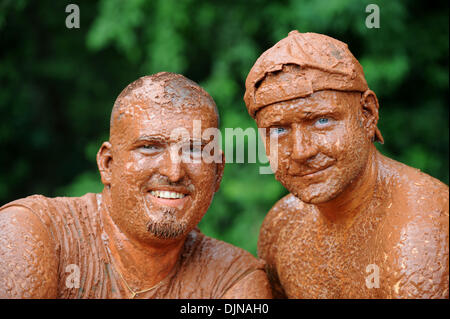 Mar 11, 2008 - East Dublin, Georgia, USA - Bubba Womack, left, and Jerry Minix after getting dirty in the mudpit while attending the 13th annual Summer Redneck Games at Buckeye Park in East Dublin, Georgia, on Saturday. The annual homage to Southerners, began as a spoof to the 1996 Summer Olympics in Atlanta. Thousands of revelers attend the event whose events include bobbing for p Stock Photo