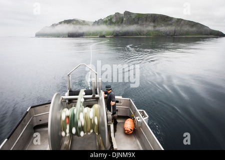 Motion Blur Of Setting Out The Gillnet While Commercial Salmon Fishing Near Cape Pankof On Unimak Island. Stock Photo