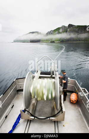 Motion Blur Of Setting Out The Gillnet While Commercial Salmon Fishing Near Cape Pankof On Unimak Island. Stock Photo