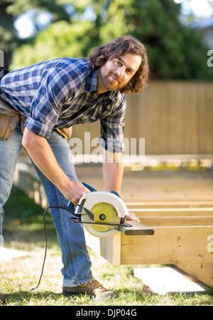 Carpenter Using Circular Saw Stock Photo