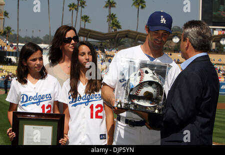 Mar. 28, 2008 - Los Angeles, California, U.S. - Los Angeles Dodgers catcher Brad Ausmus (12) receives a gift from general manager Ned Colletti as Ausmus retired at the end of the 2010 season before a Major League baseball game at Dodger Stadium on Sunday, October 3, 2010, in Los Angeles. (SGVN/Staff Photo by Keith Birmingham/SPORTS) (Credit Image: © San Gabriel Valley Tribune/ZUMAp Stock Photo