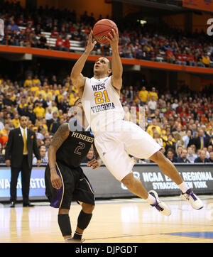 Mar. 25, 2010 - Syracuse, Kentucky, USA - West Virginia's 21- Joe Mazzulla scored on a drive past Washington's 2- Isaiah Thomas as West Virginia played Washington in NCAA tournament action in the Carrier Dome in Syracuse, NY, Thursday, March, 25, 2010. This is first half action. Photo by Charles Bertram (Credit Image: © Lexington Herald-Leader/ZUMApress.com) Stock Photo