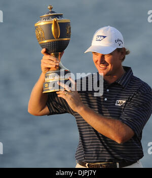 Mar. 14, 2010 - Doral, FL - Florida, USA - United States - Doral---fl-doral-golf-0314d----Action from the final round of the CA Championship at the Doral Golf Resort and Spa.   Champion Ernie Els, of South Africa, smiles as he holds up the championship trophy.         Robert Duyos,  Sun Sentinel (Credit Image: © Sun-Sentinel/ZUMApress.com) Stock Photo