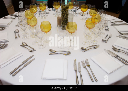 Table laid out ready for service at event Stock Photo