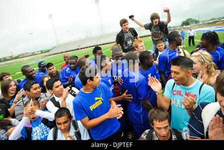 Apr 16, 2010 - New Braunfels, Texas, USA - New Braunfels High School students cheer for the Haiti men's national soccer team after the team's practice Friday, April 16, 2010 at New Braunfels High School. The team is practicing in central Texas for two-and-half weeks as their home stadium is temporarily housing displaced Haitian refugees. (Credit Image: © Bahram Mark Sobhani/ZUMA Pr Stock Photo