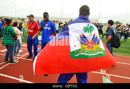 Apr 16, 2010 - New Braunfels, Texas, USA - A Haiti men's national soccer team player wears the Haitian flag around his shoulders  Friday, April 16, 2010 at New Braunfels High School. The team is practicing in central Texas for two-and-half weeks as their home stadium is temporarily housing displaced Haitian refugees (Credit Image: © Bahram Mark Sobhani/ZUMA Press) Stock Photo