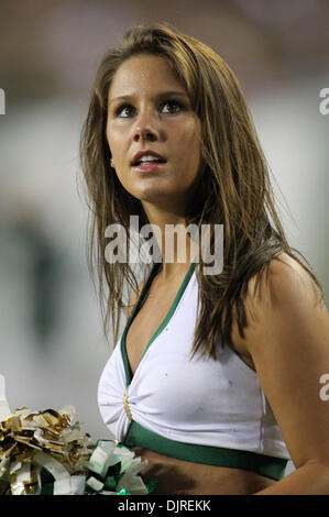 Apr. 17, 2010 - Tampa, Florida, U.S - 17 April 2010: A USF cheerleader takes a break during the game.  Team South Florida defeated Team Bulls  52-31 as USF played their spring football game at Raymond James Stadium in Tampa, Florida (Credit Image: © Margaret Bowles/Southcreek Global/ZUMApress.com) Stock Photo