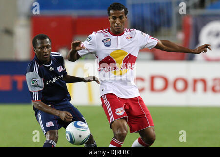 May 29, 2010 - Foxboro, Massachusetts, U.S - 29 May 2010:  New York Red Bulls Defender Danleigh Borman (11) kicks the ball away from New England Revolution Midfielder Sainey Nyassi (14) during game play at Gillette Stadium, Foxboro, Massachusetts..Mandatory Mark Box / Southcreek Global (Credit Image: © Mark Box/Southcreek Global/ZUMApress.com) Stock Photo