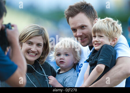 Apr. 14, 2010 - Los Angeles, California, U.S - 14 April 2010:  Dodgers team photographer John Soohoo takes a picture of television personality Joel McHale posing with his family before the Los Angeles Dodger's first home night game of the season against the Arizona Diamondbacks at Dodger Stadium in Los Angeles, California. .Mandatory Credit: Andrew Fielding / Southcreek Global (Cre Stock Photo