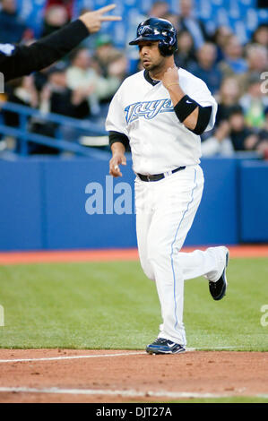 Apr. 15, 2010 - Toronto, Ontario, Canada - 15 April 2010 Toronto, Ontario:  Toronto Blue Jays shortstop Alex Gonzalez #11, scores after his 2 run homer  in the bottom of the third inning against the Chicago White Sox on Thursday at Rogers Centre in Toronto, Ontario. (Credit Image: © Darren Eagles/Southcreek Global/ZUMApress.com) Stock Photo